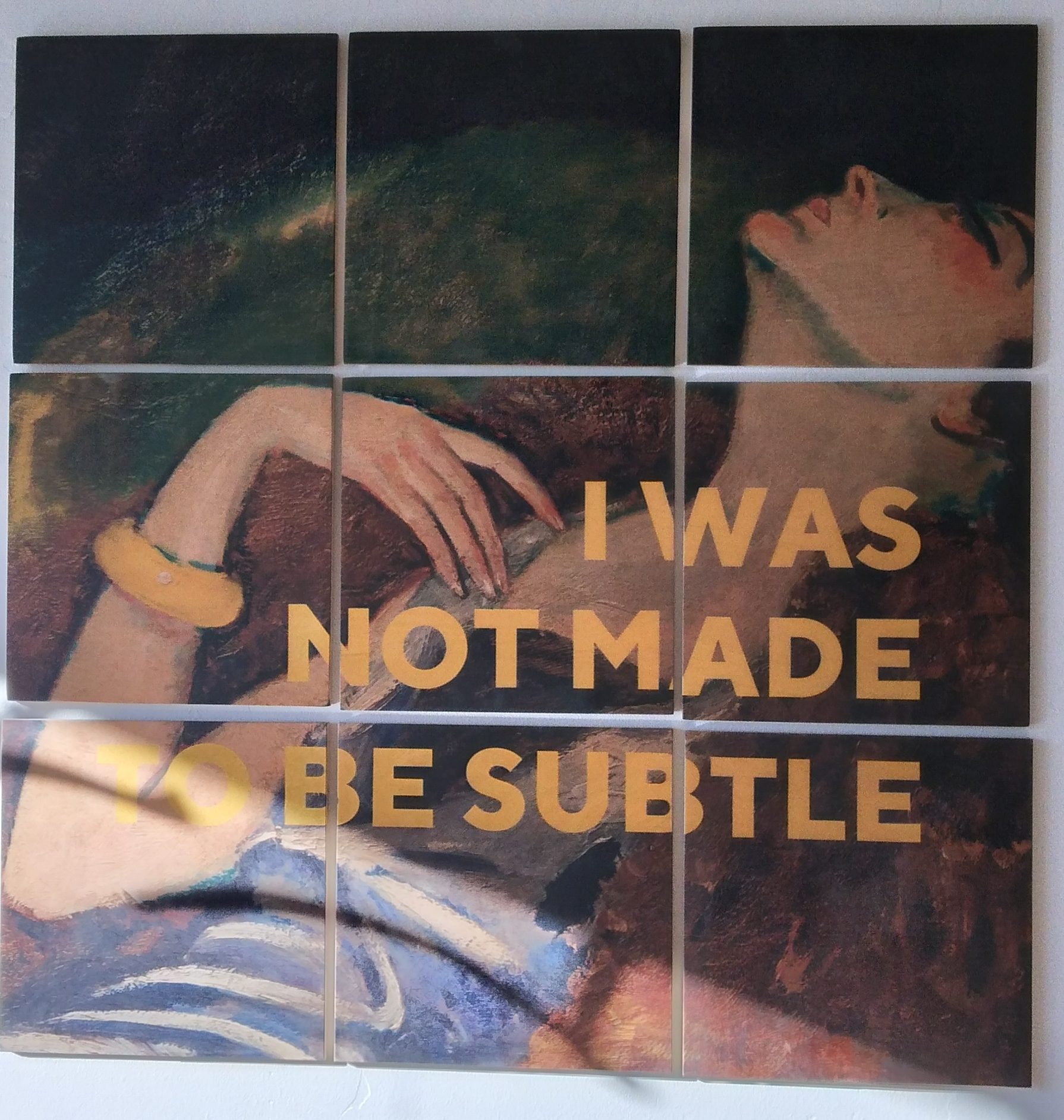 Painting on display at Crazy Woman Cellars. The text "I Was Not Made to be Subtle" is printed over a painting of a woman.