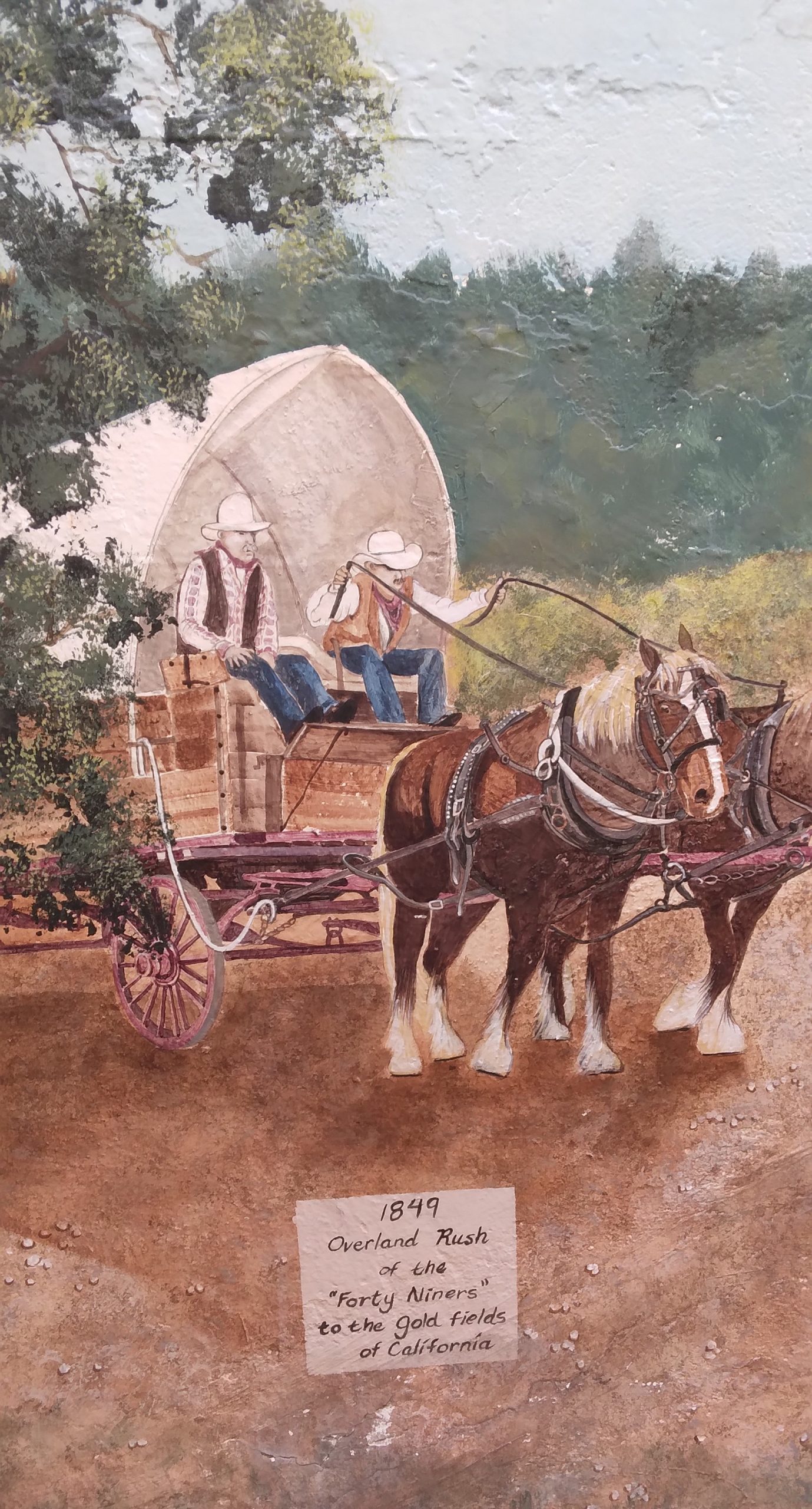 Wall with painting of a stagecoach